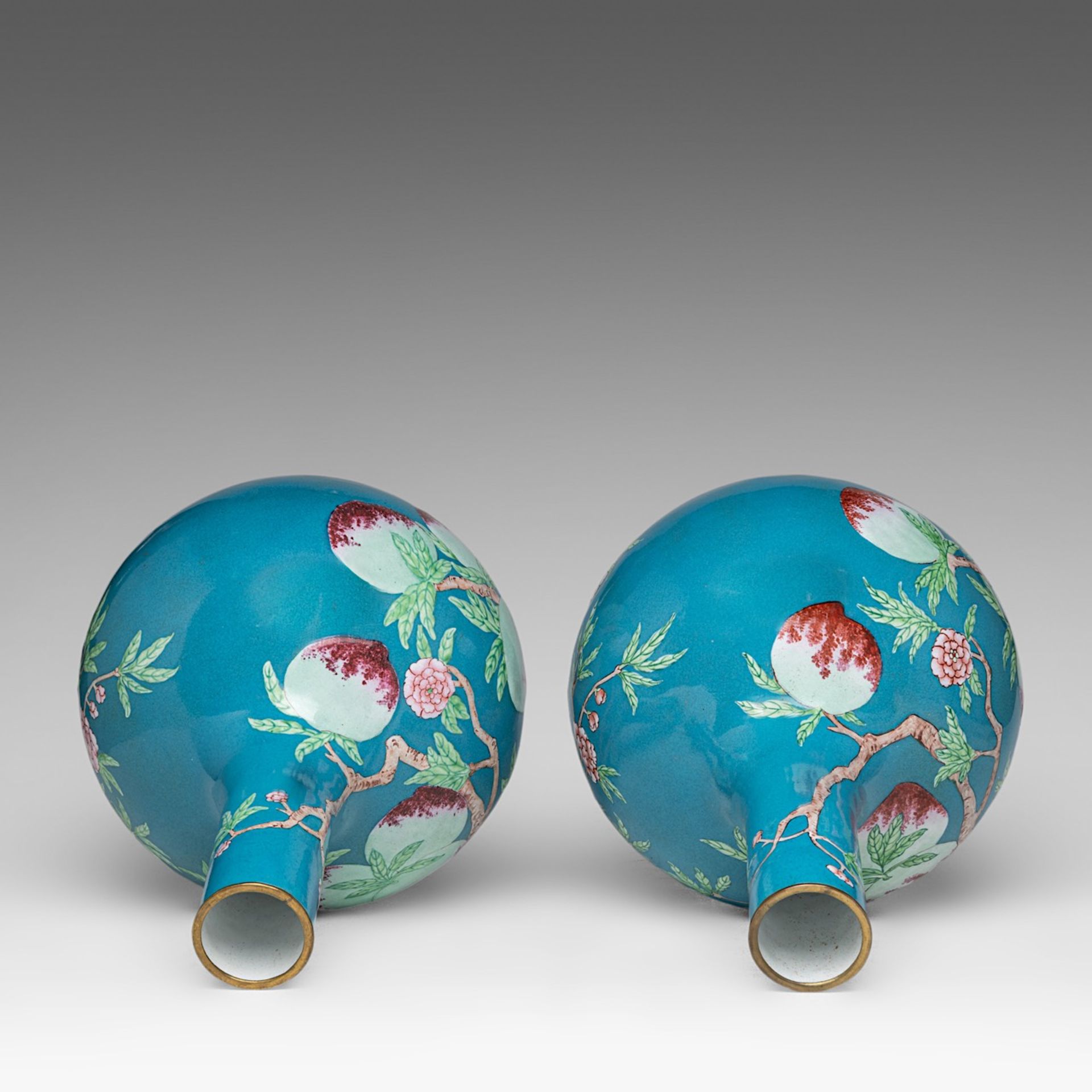 A fine pair of Chinese turquoise ground Canton enamel on copper 'Nine Peaches' bottle vases, late Qi - Image 5 of 6