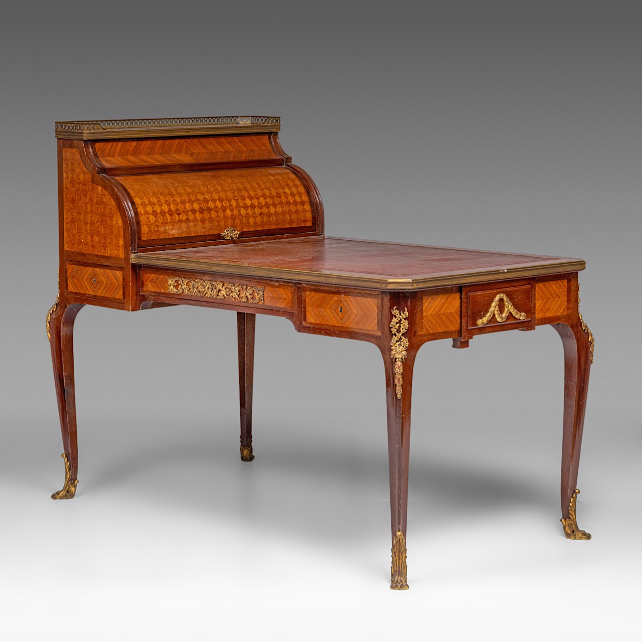 A leather-topped Transitional-style bureau plat and rolltop desk with parquetry and gilt bronze moun