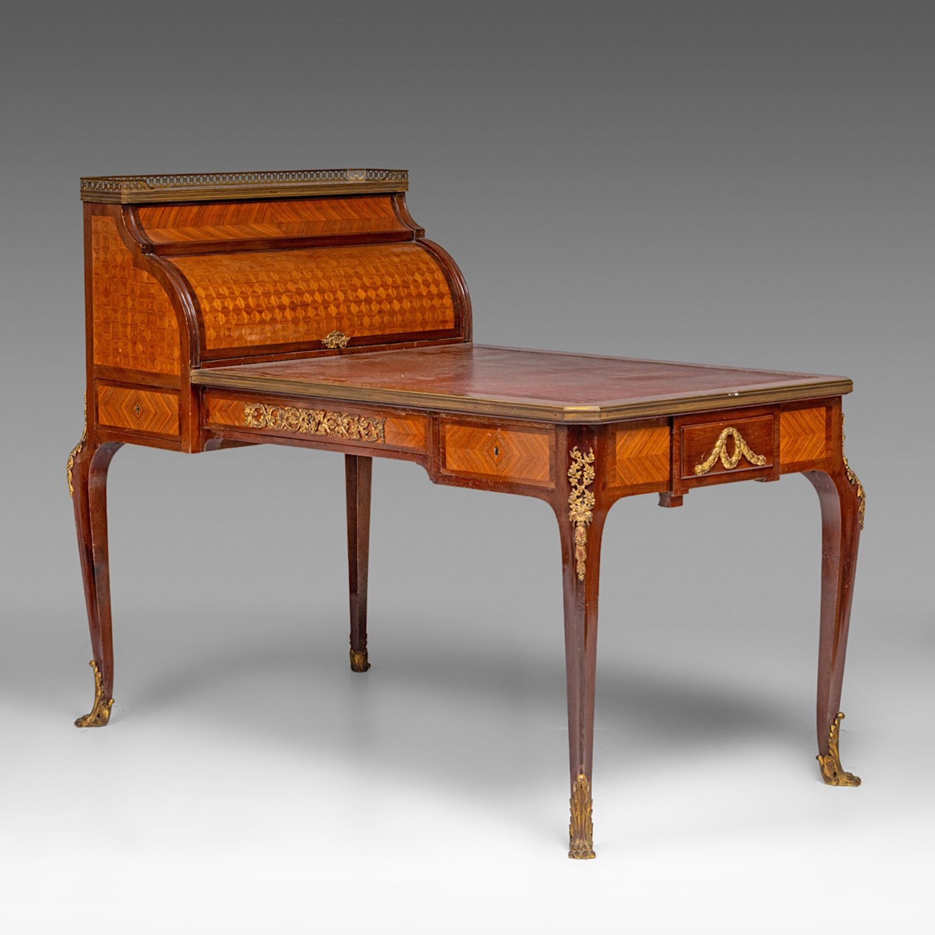 A leather-topped Transitional-style bureau plat and rolltop desk with parquetry and gilt bronze moun