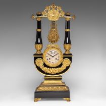 A French Restoration black lacquered and gilt bronze mounted lyre-shaped mantle clock, H 58 cm