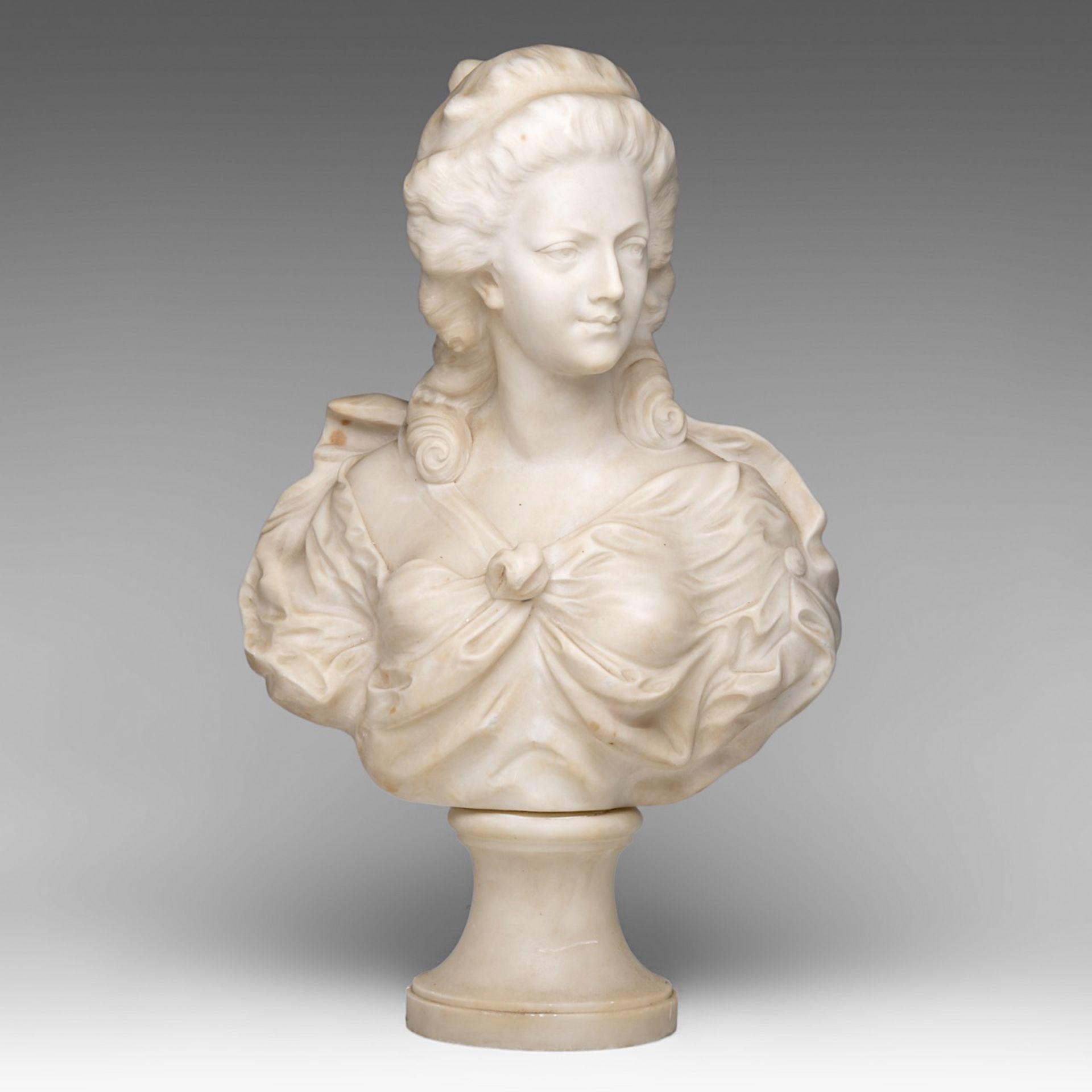 An alabaster bust of a female beauty in the Louis XVI era (Marie-Antoinette?), H 56 cm