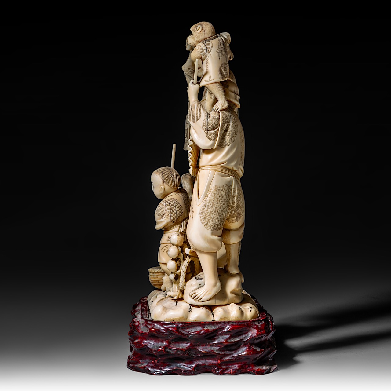 A large Japanese walrus ivory okimono of a musical family, Meiji period (1868-1912), H 26 cm - 1906g - Image 3 of 12