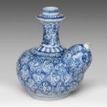 A Chinese blue and white Kendi jug decorated with scrolling tendrils, marked with a rabbit, 17thC, H