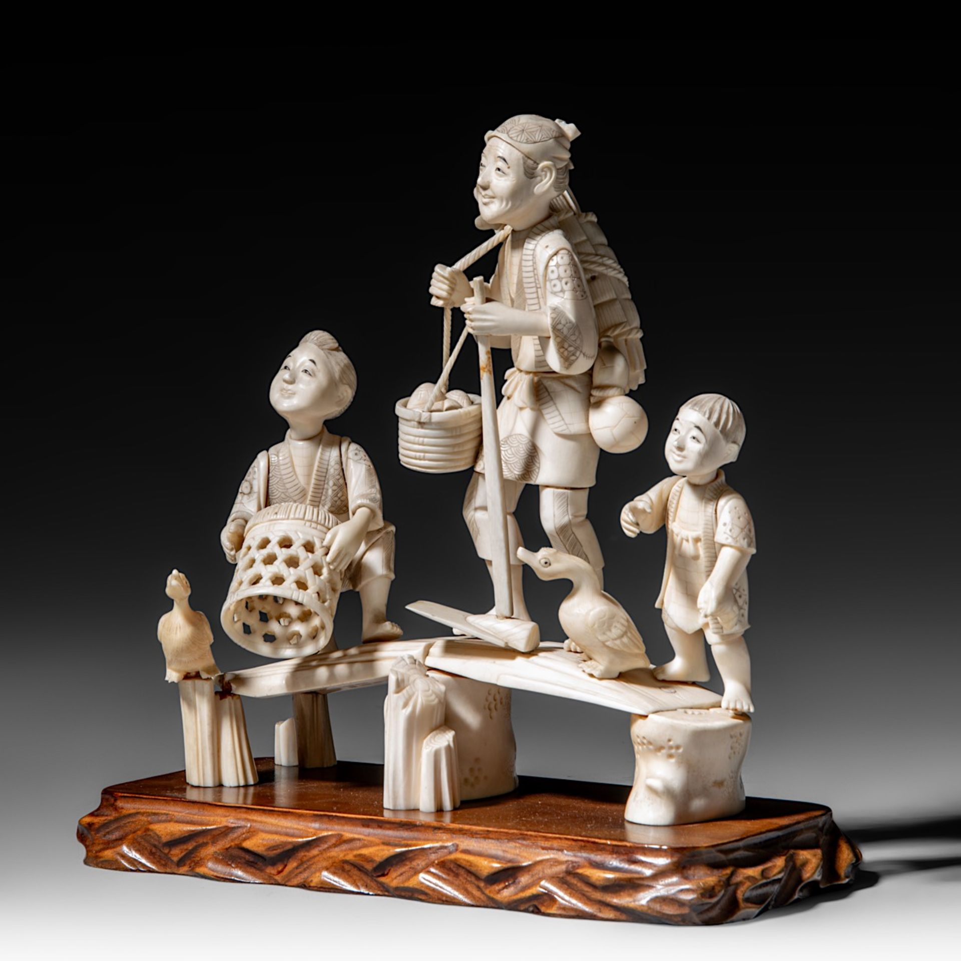 A Japanese hippo and walrus ivory okimono of a family fishing, Showa period (1926-1989), H 20 cm - W - Image 2 of 11