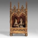 A finely sculpted polychrome and gilt wooden Gothic Revival shrine with a medieval court scene, H 80