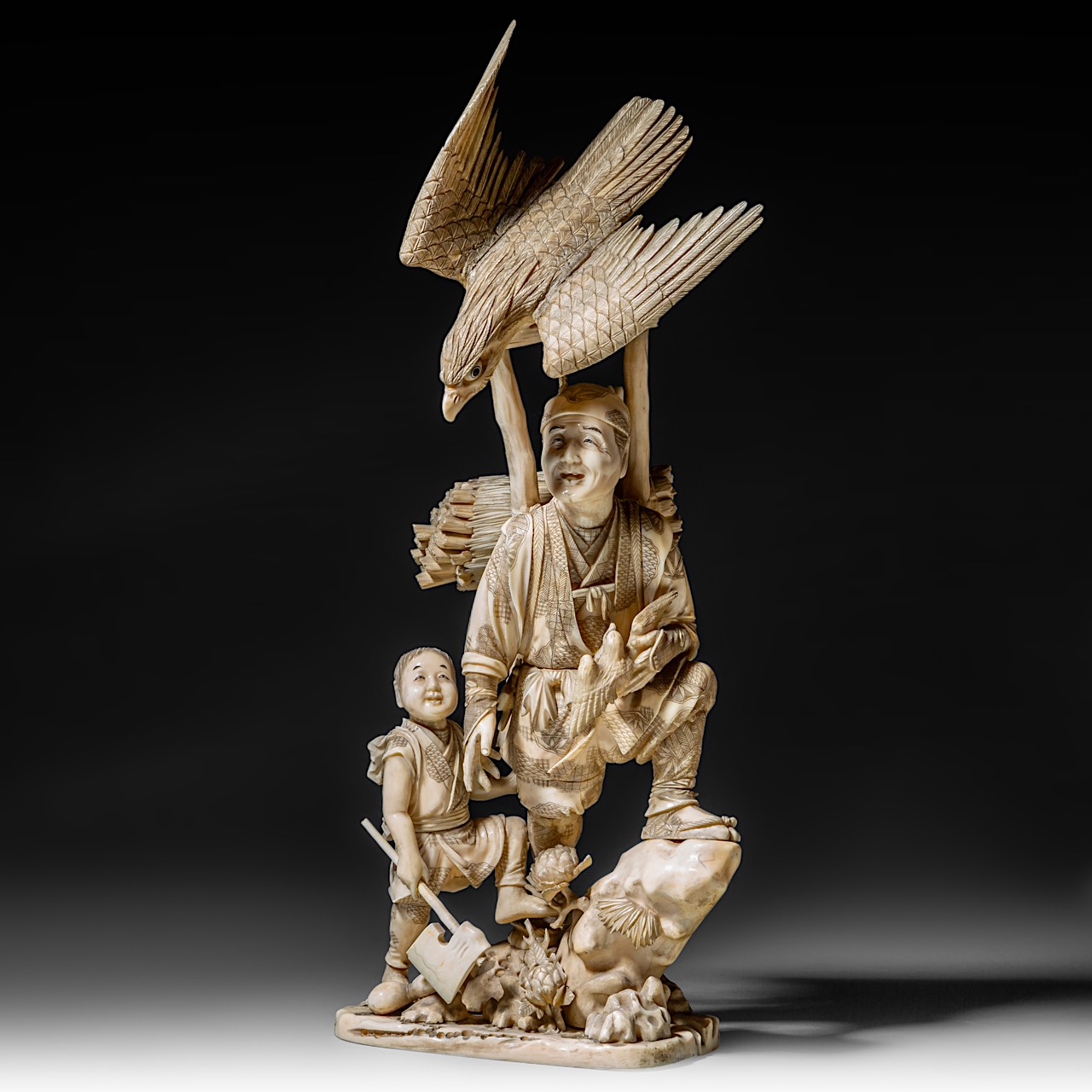 A large and fine Japanese walrus ivory okimono of a falconer and his son watching an eagle, Meiji pe - Image 2 of 13