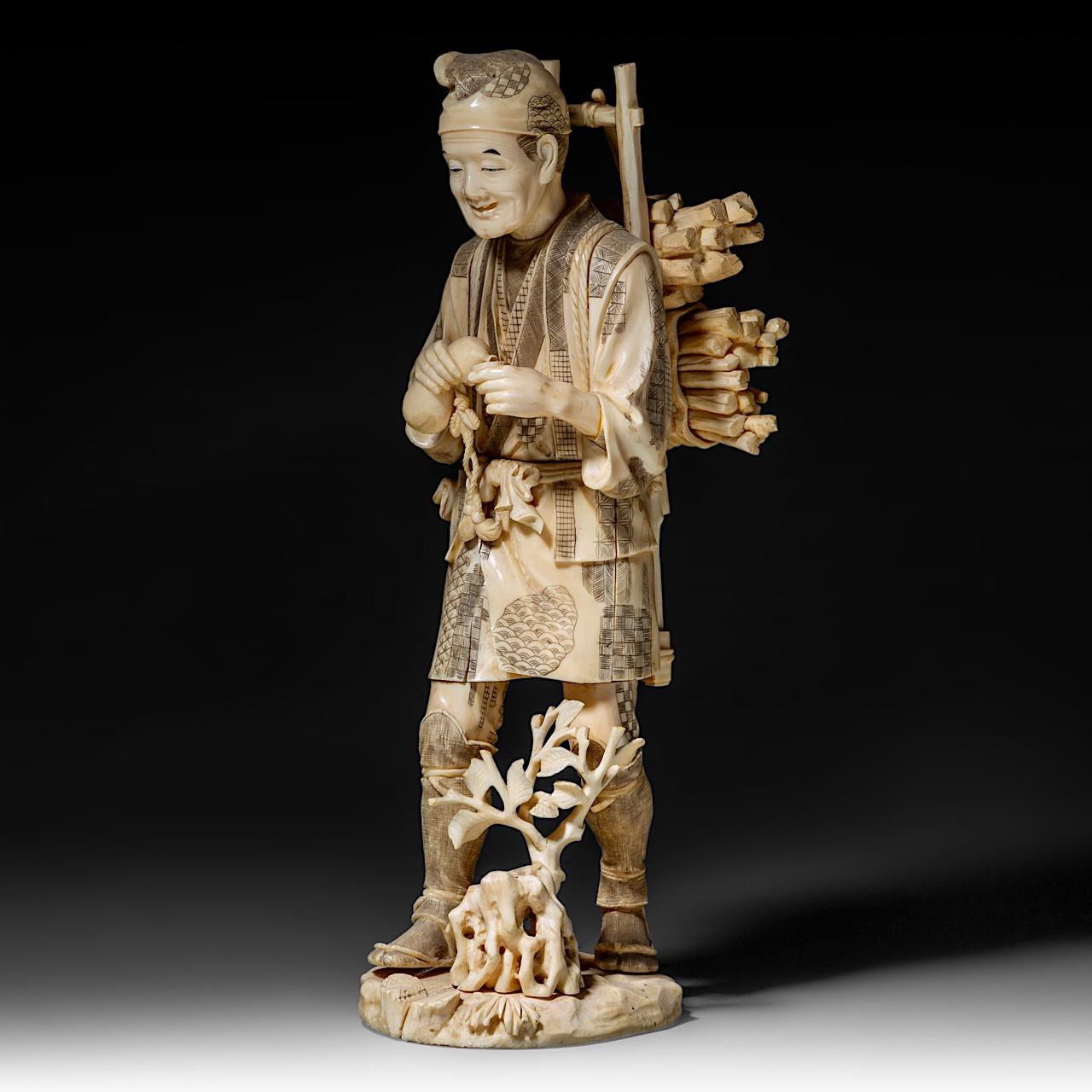 A large Japanese walrus ivory okimono of a wood gatherer drinking from a gourd flask, Meiji period ( - Image 2 of 10