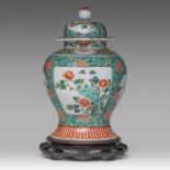 A Chinese famille verte 'Flower Gardens' covered vase, late 19thC/Republic period, H 35 cm