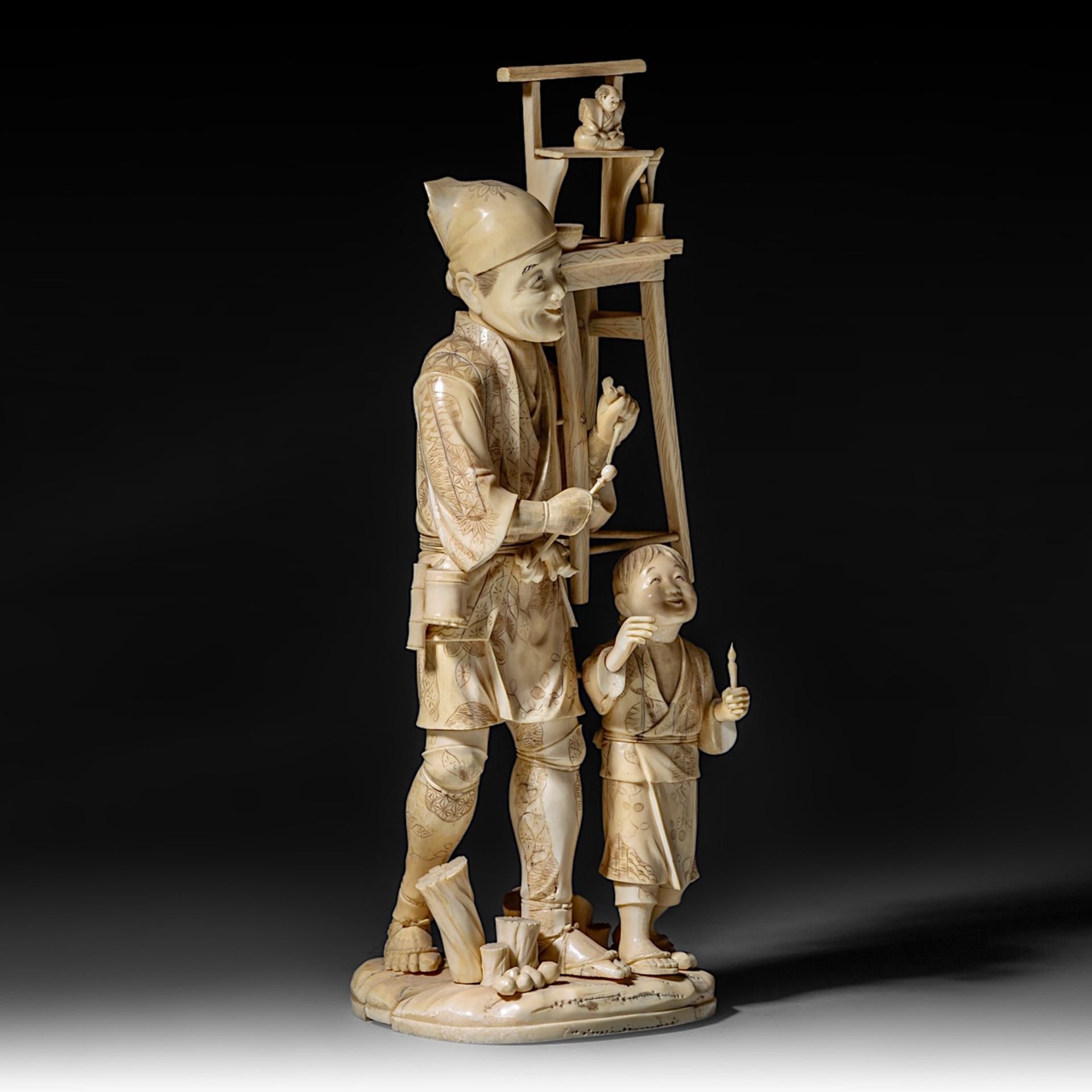 A large Japanese walrus ivory okimono of an artisan with his son, Meiji period (1868-1912), H 46,5 - - Image 8 of 13