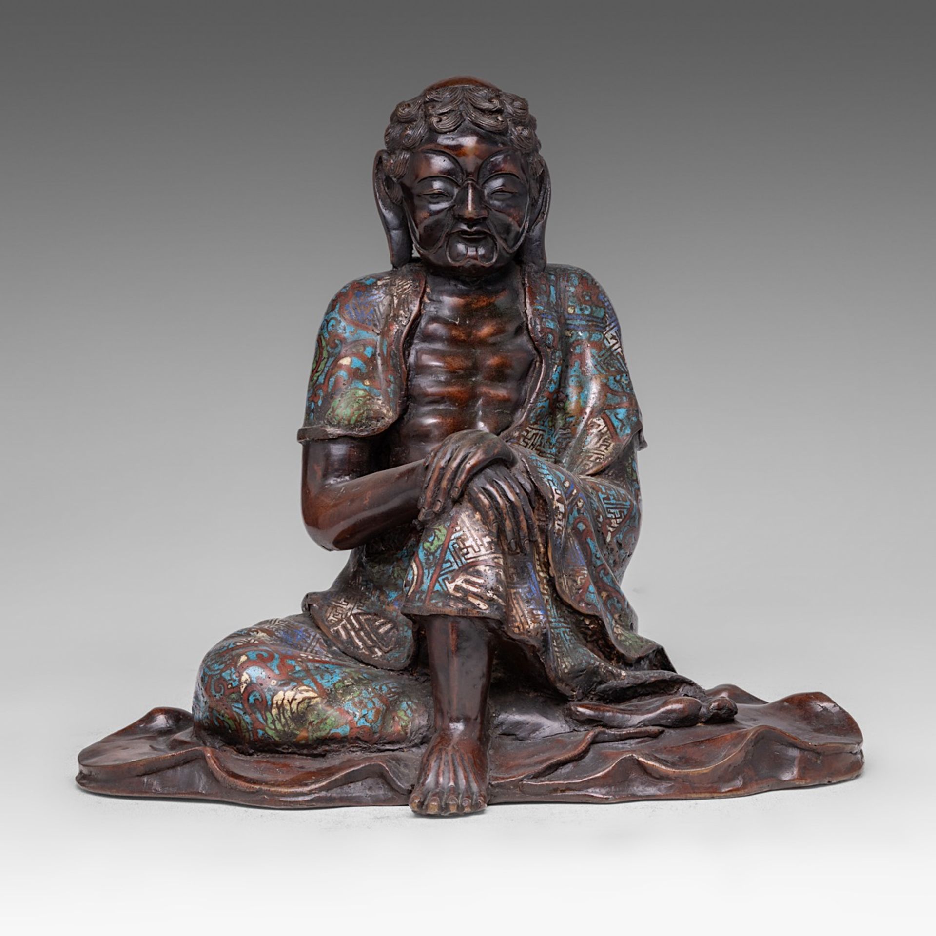 A Japanese champleve enamelled bronze figure of fasting Buddha Gautama, late Meiji (1868-1912), H 36