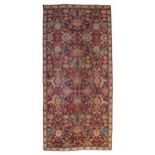 An Oriental rug, floral decorated, 187 x 398 cm