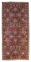 An Oriental rug, floral decorated, 187 x 398 cm