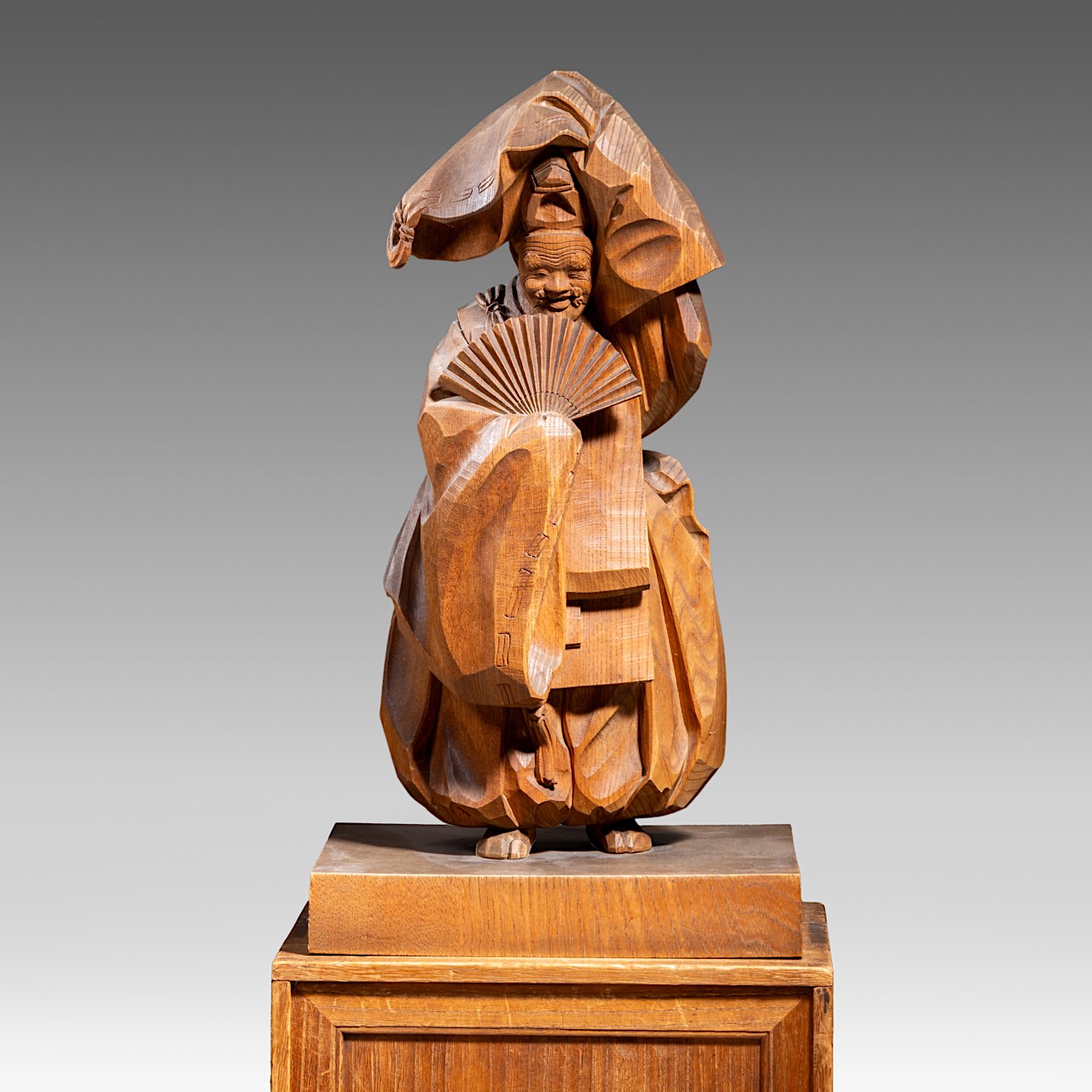 A Japanese cherrywood sculpture of a dancing man, signed Toshiaki Shimamura, total H 47 - 25,5 x 23