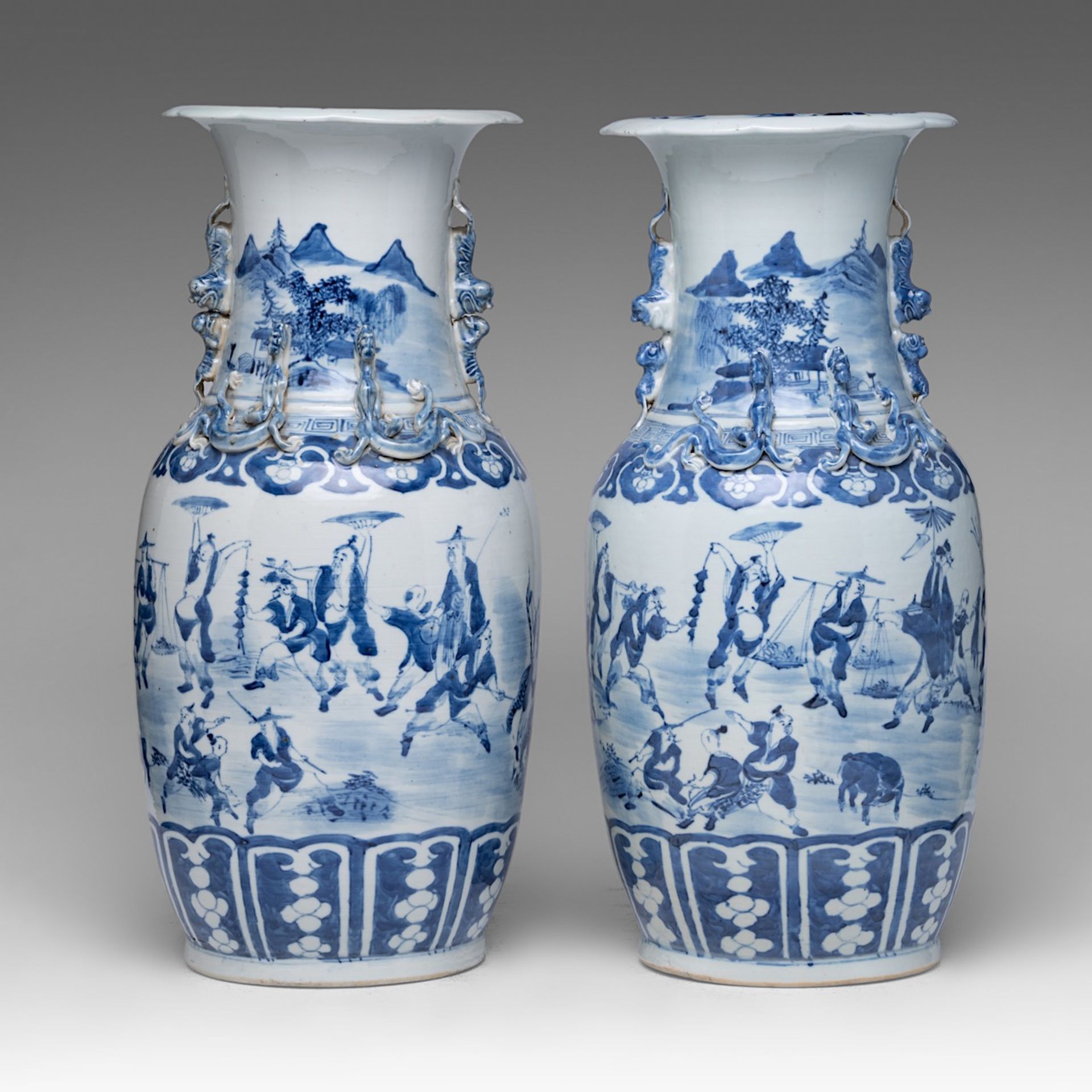 A pair of Chinese blue and white 'Figures in a Daily Life Scene' vases, 19thC, H 45 cm