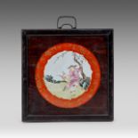 A Chinese famille rose 'European Figures' porcelain plaque, fitted in a wooden frame, total 35,5 x 3