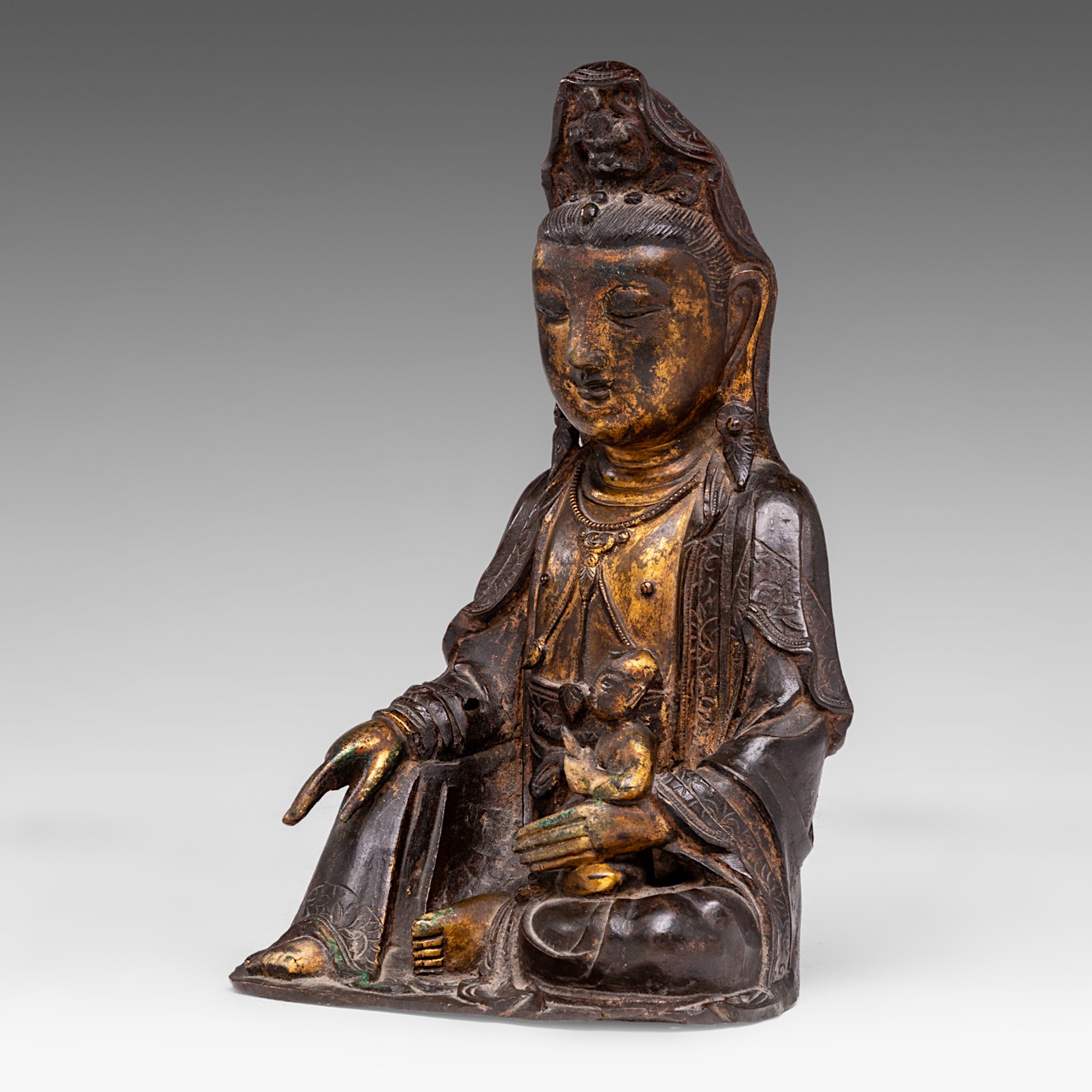 A Chinese gilt bronze figure of seated Bodhisattva Avalokiteshvara (Songzi Guanyin), late Ming, H 22 - Image 3 of 8
