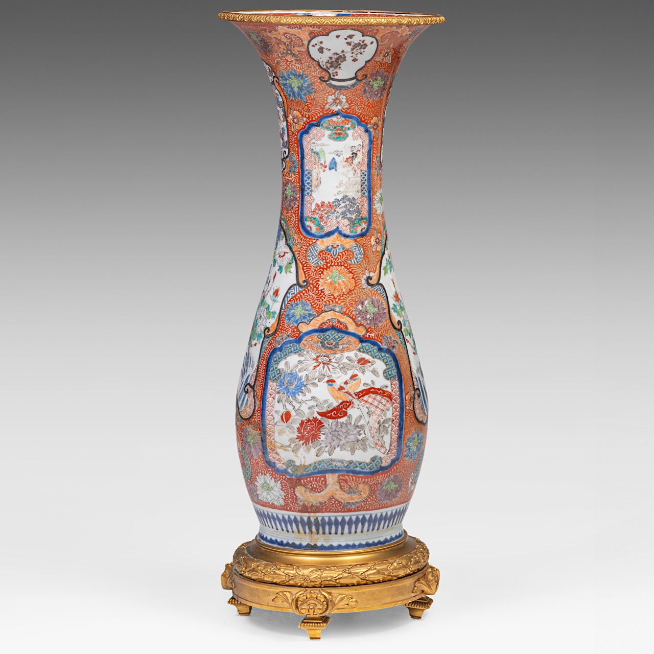 A large Japanese Imari vase, fixed on a gilt bronze foot and with a ditto rim, late Meiji (1868-1912