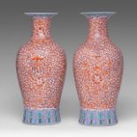 A pair of Chinese iron-red 'Lotus Scroll and Bats' baluster vases, H 44,5 cm
