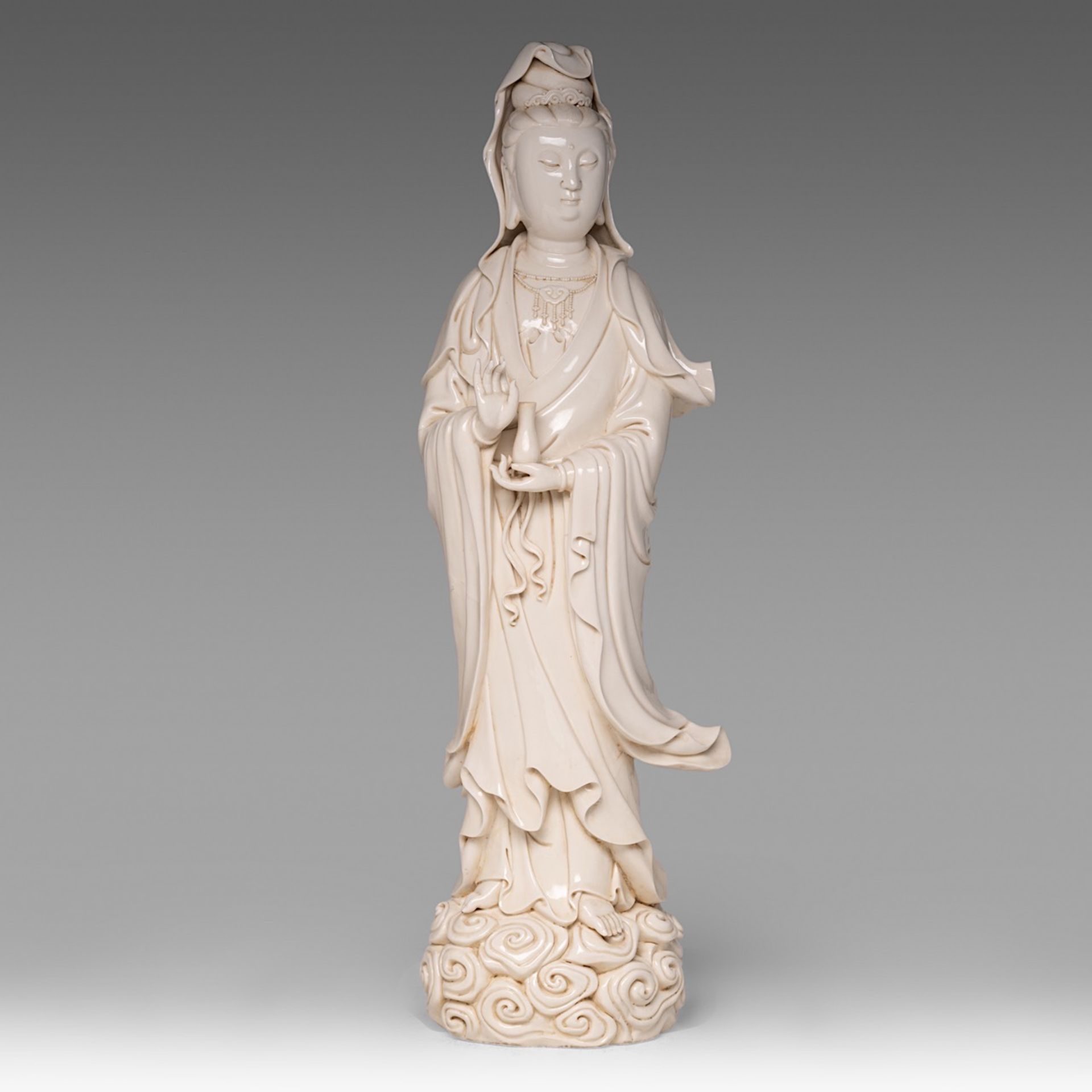 A large Chinese Dehua blanc-de-chine standing Guanyin, marked 'He Chaozong', H 69 cm