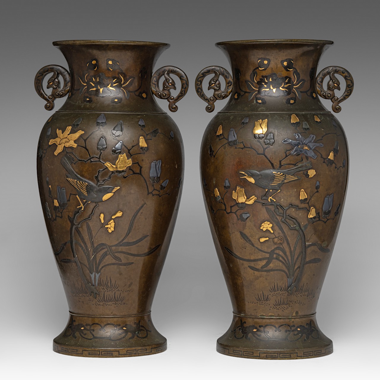 A pair of Japanese bronze 'Phoenix' vases with gilt details, Meiji period (1868-1912), both H 41,5 c - Image 3 of 6