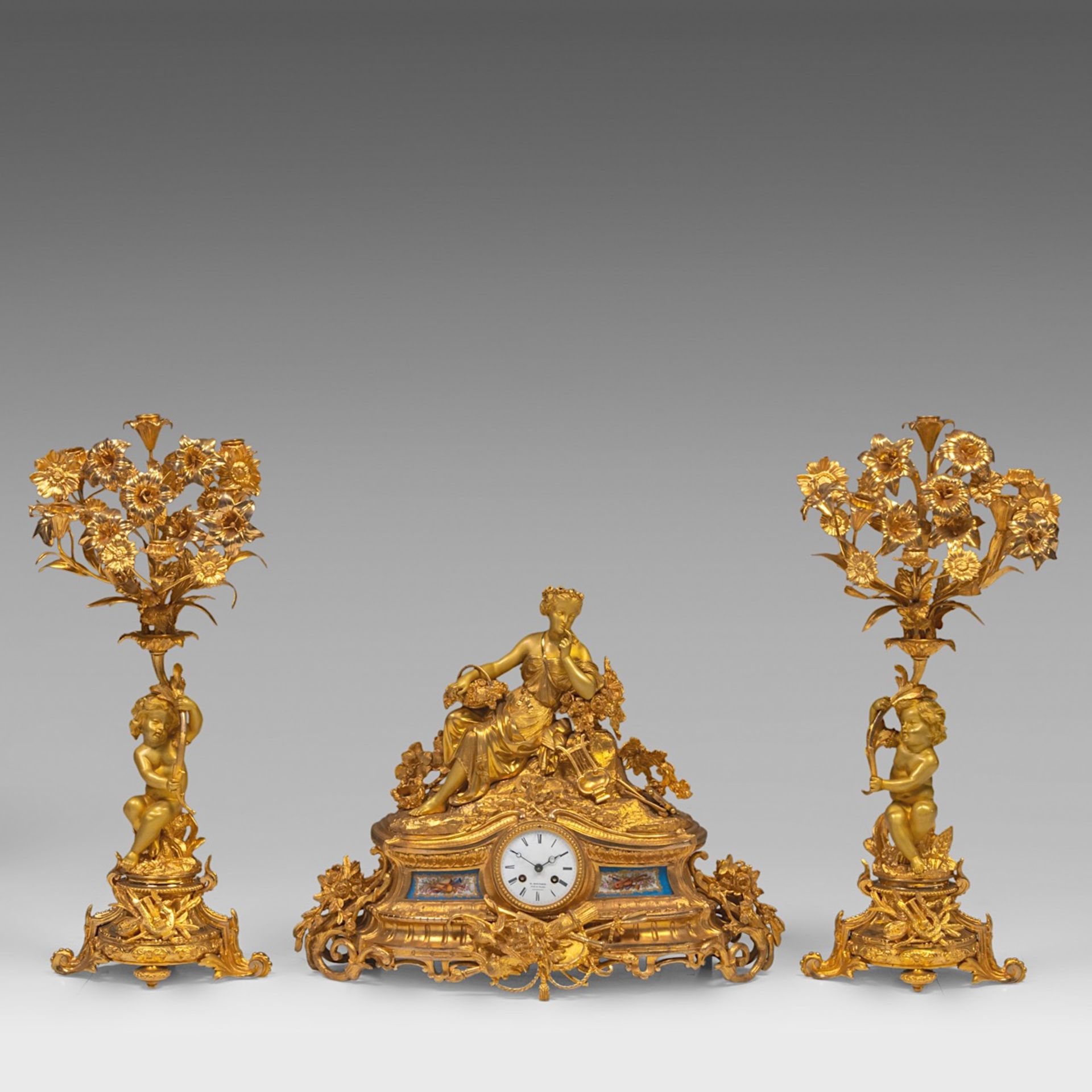 A Napoleon III gilt bronze three-piece mantle clock set, signed 'R. Bouvier, Bruxelles', H 48 - 66 c