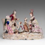A large Saxony polychrome porcelain group depicting a gallant scene in a Rococo setting, H 40 - W 55