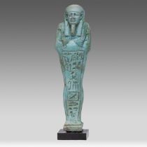 An Egyptian turquoise faience Ushabti of Ipethemetes with crisp hieroglyphics in a vertical panel, H