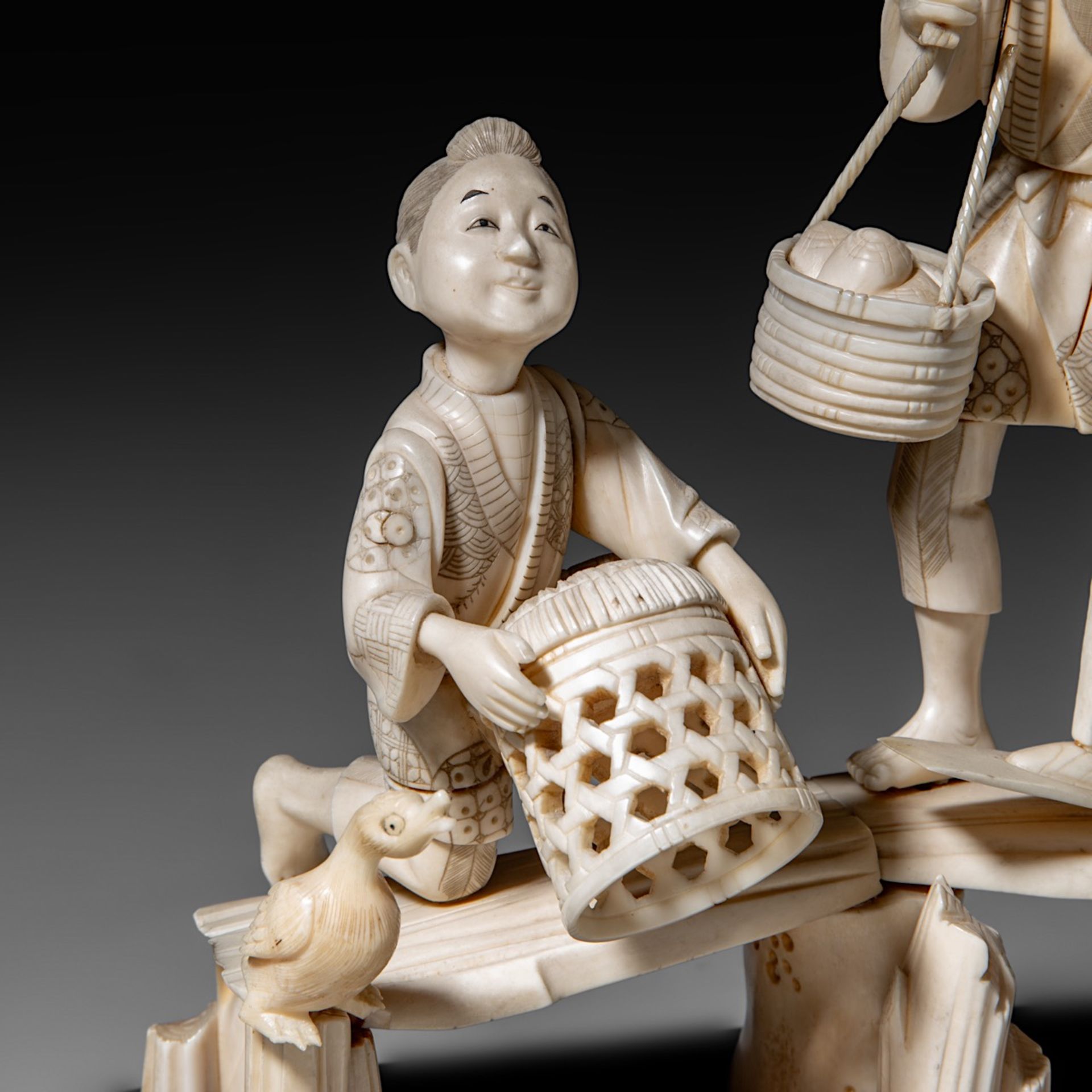 A Japanese hippo and walrus ivory okimono of a family fishing, Showa period (1926-1989), H 20 cm - W - Image 9 of 11