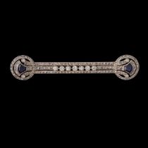 An Art Deco 18CT white gold brooch, set with rose cut diamonds and synthetic sapphires, L 7,2 cm, we