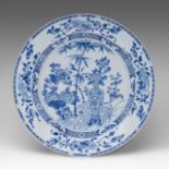 An unusually large Chinese blue and white 'Flower vase in a Garden' plate, 18thC, dia 42,3 cm
