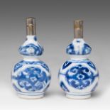 Two Chinese blue and white floral decorated double gourd vases, Kangxi period, H 13 cm