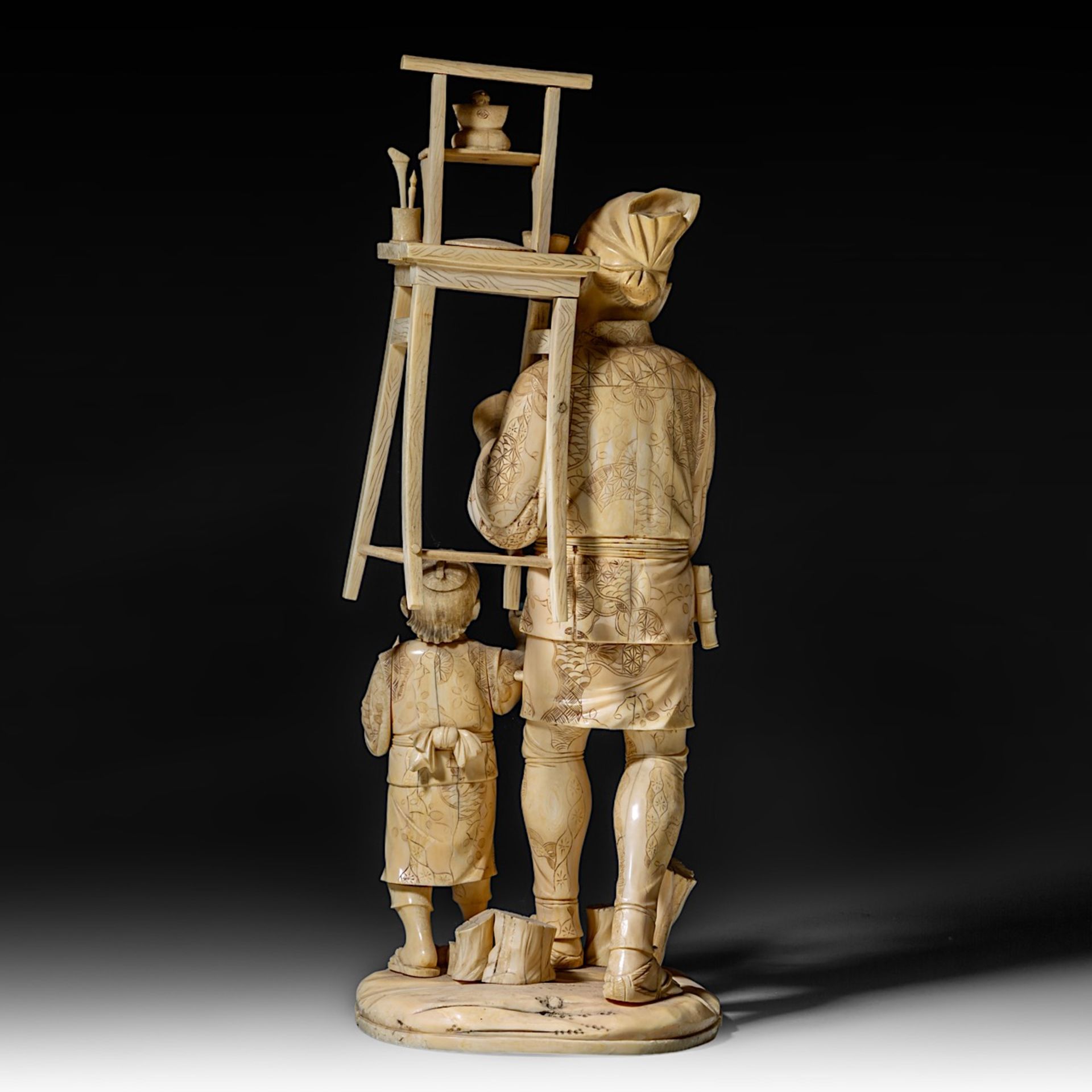 A large Japanese walrus ivory okimono of an artisan with his son, Meiji period (1868-1912), H 46,5 - - Image 5 of 13