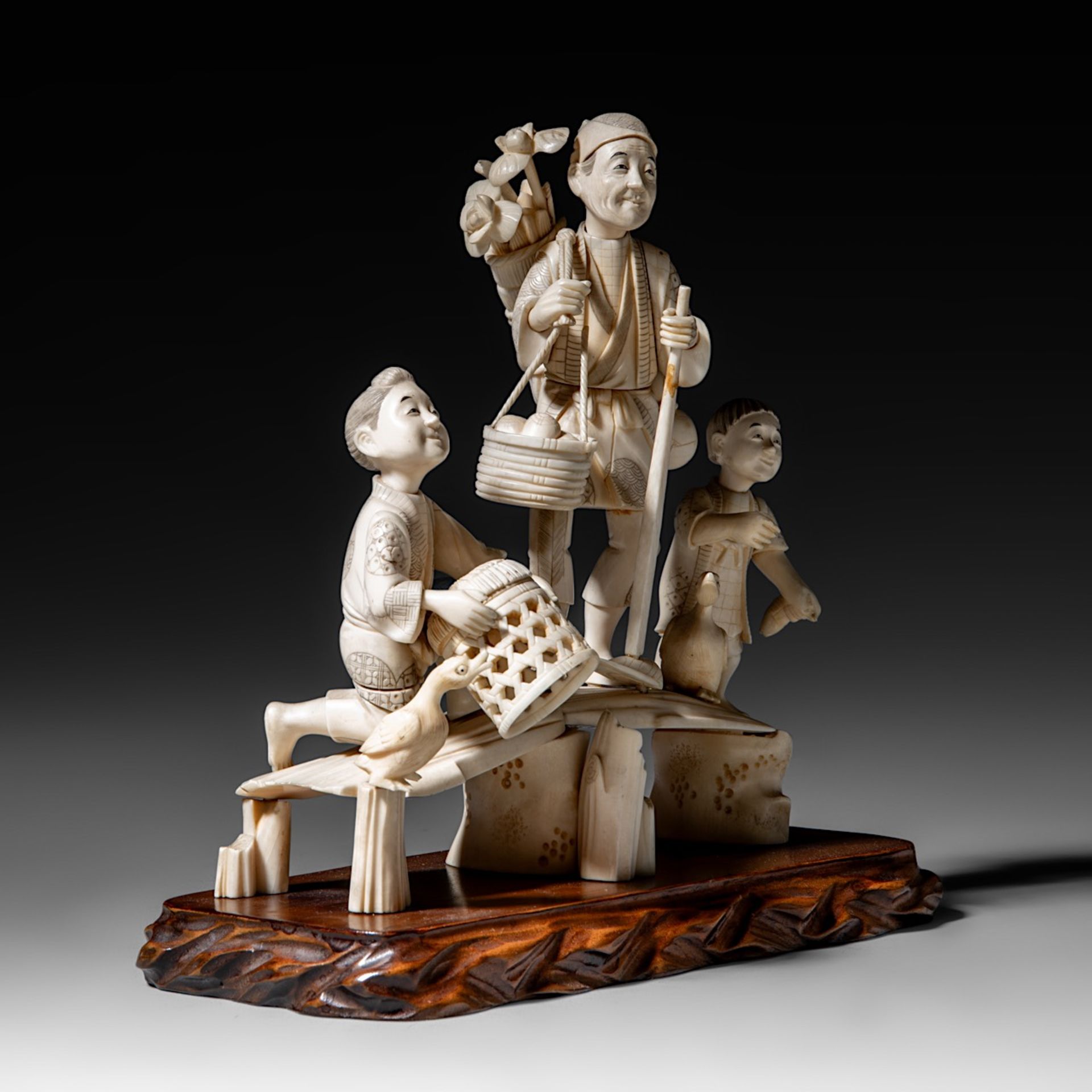 A Japanese hippo and walrus ivory okimono of a family fishing, Showa period (1926-1989), H 20 cm - W - Image 8 of 11