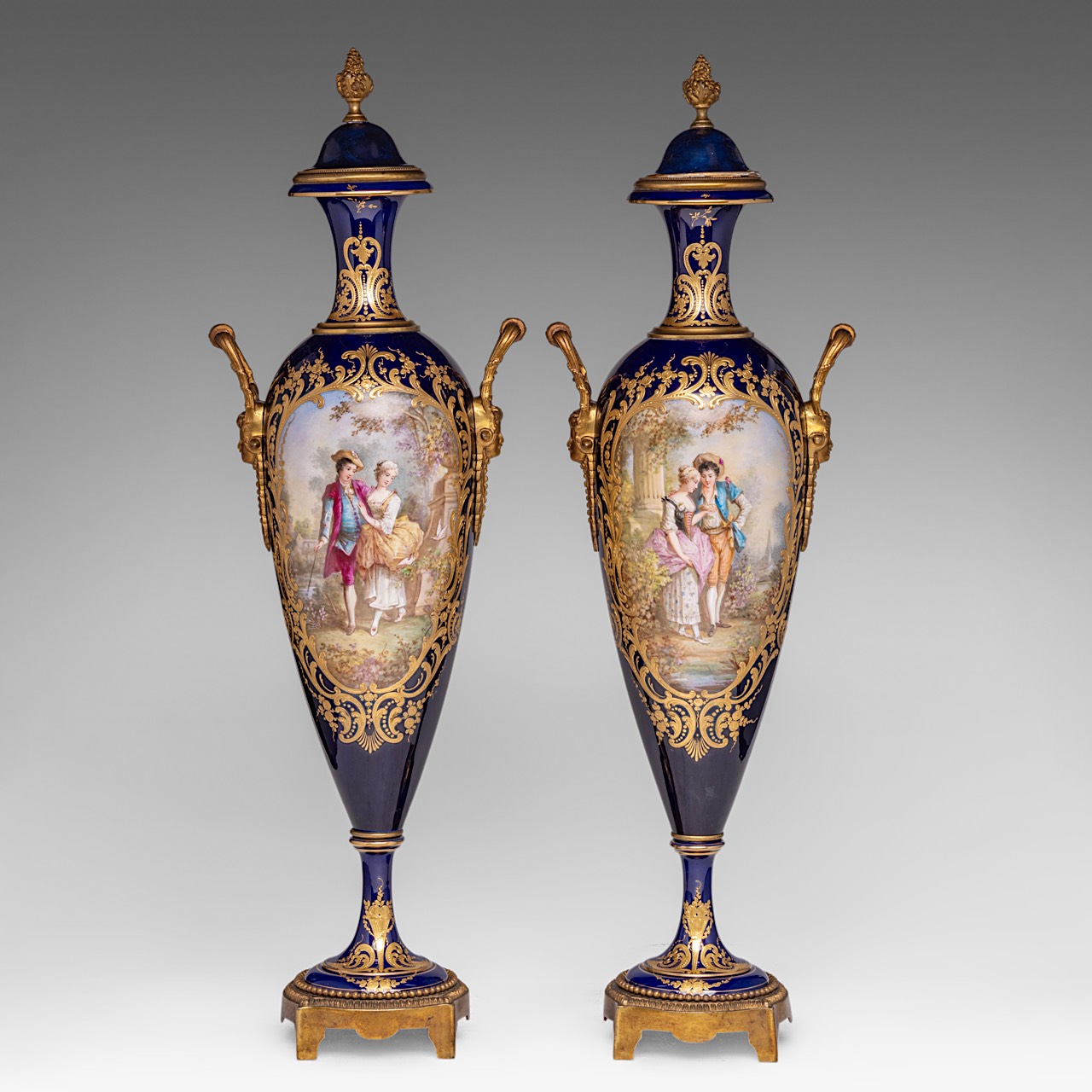 An pair of Sevres vases, with gallant scenes and gilt brass mounts, H 65 cm
