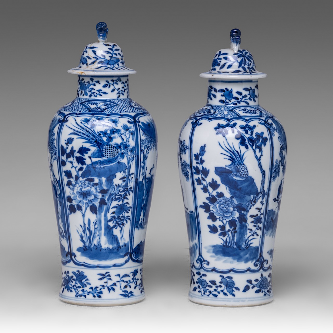 A near pair of Chinese blue and white 'Li Tieguai' lidded vases, with a Kangxi mark, 19thC, Total H - Image 2 of 8