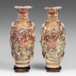 A pair of Japanese Satsuma vases standing on hardwood bases, 20thC, H 79 cm (without base)