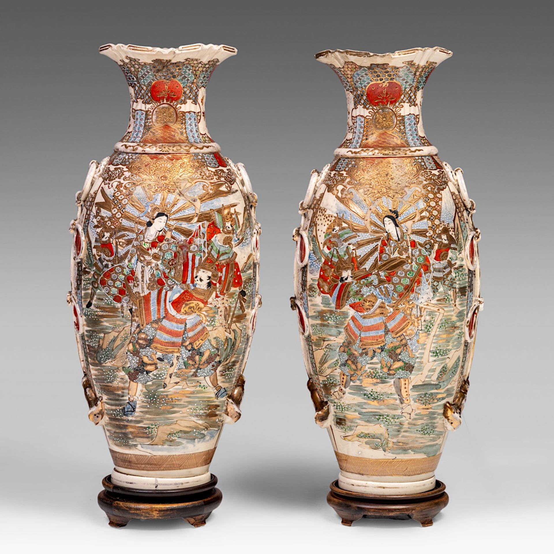 A pair of Japanese Satsuma vases standing on hardwood bases, 20thC, H 79 cm (without base)