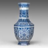 A Chinese blue and white 'Scrolling Lotus' facetted bottle vase, with a Qianlong mark, H 42 cm