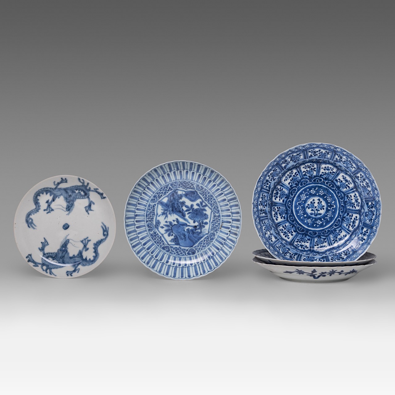A small collection of Chinese blue and white dishes, including a 'Dragon' plate, Ming dynasty, and K