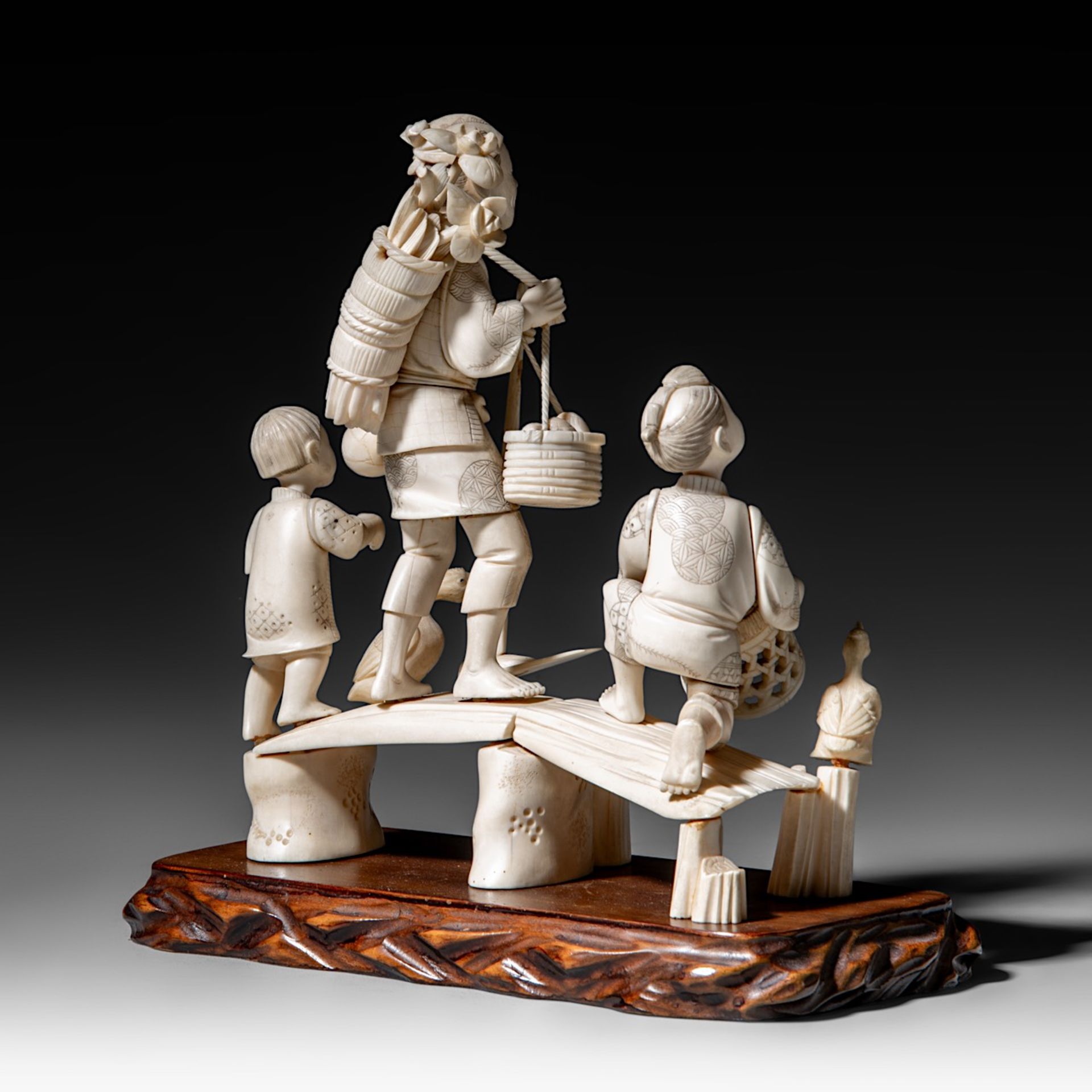 A Japanese hippo and walrus ivory okimono of a family fishing, Showa period (1926-1989), H 20 cm - W - Image 6 of 11