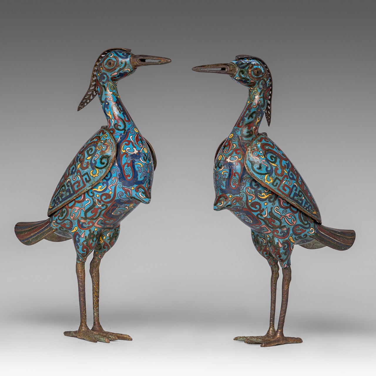 A pair of Chinese cloisonne enamelled bronze cranes, 20thC, both H 35 cm