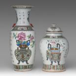 A Chinese famille rose 'Flower Baskets' vase and covered vase, the vase paired with Fu lion head han