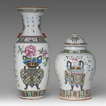 A Chinese famille rose 'Flower Baskets' vase and covered vase, the vase paired with Fu lion head han