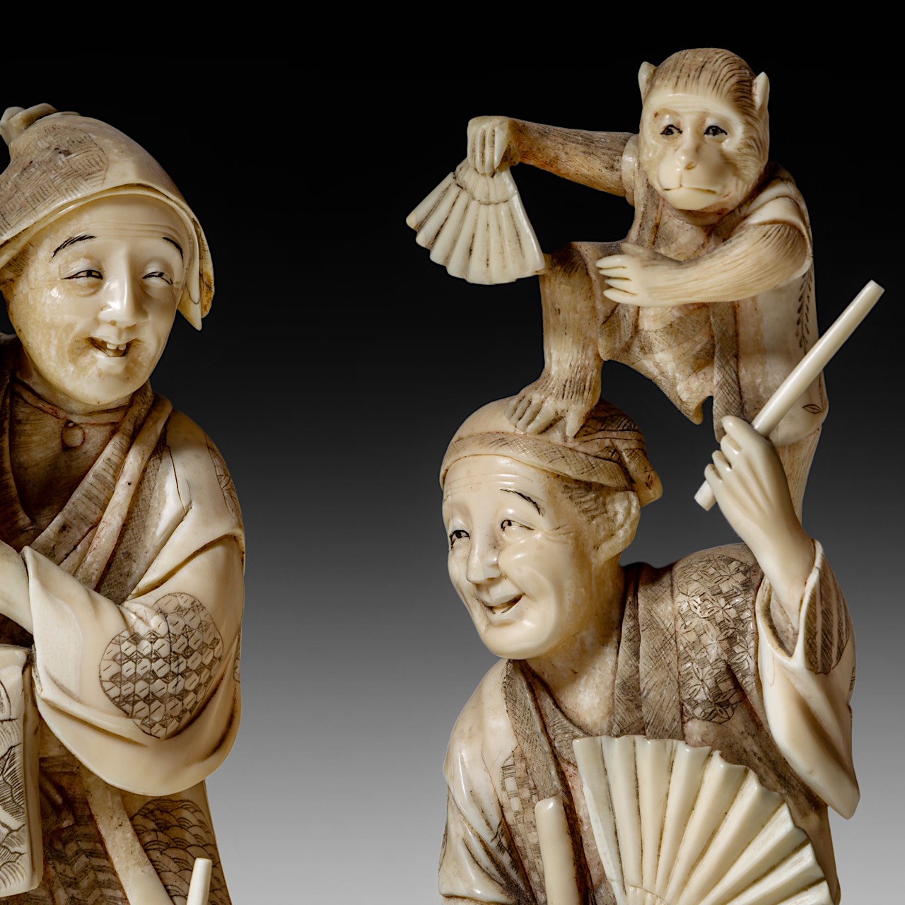 A large Japanese walrus ivory okimono of a musical family, Meiji period (1868-1912), H 26 cm - 1906g - Image 11 of 12