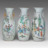 Three Chinese famille rose 'Figures in a Garden' vases, all with a signed text at the back, paired w