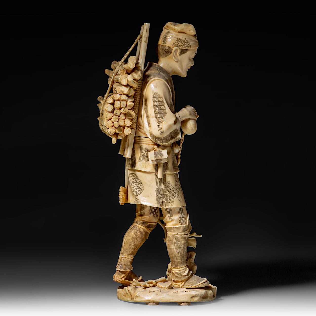 A large Japanese walrus ivory okimono of a wood gatherer drinking from a gourd flask, Meiji period ( - Image 7 of 10