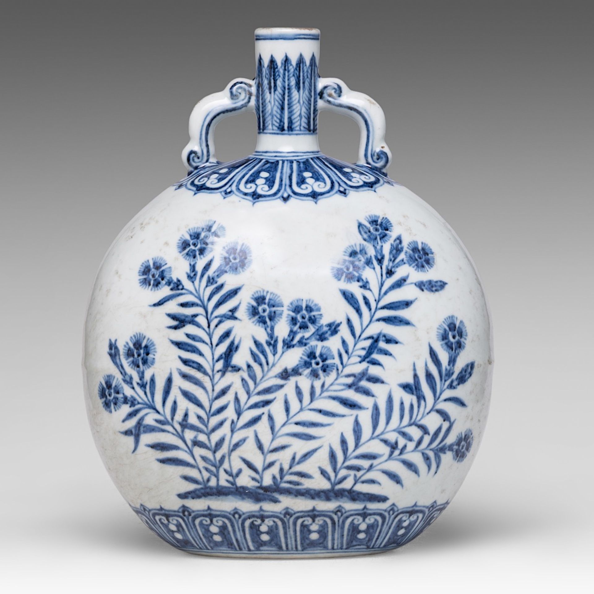 A Chinese blue and white 'Carnation and Aster' moon flask, paired with arched scroll handles, H 29,5