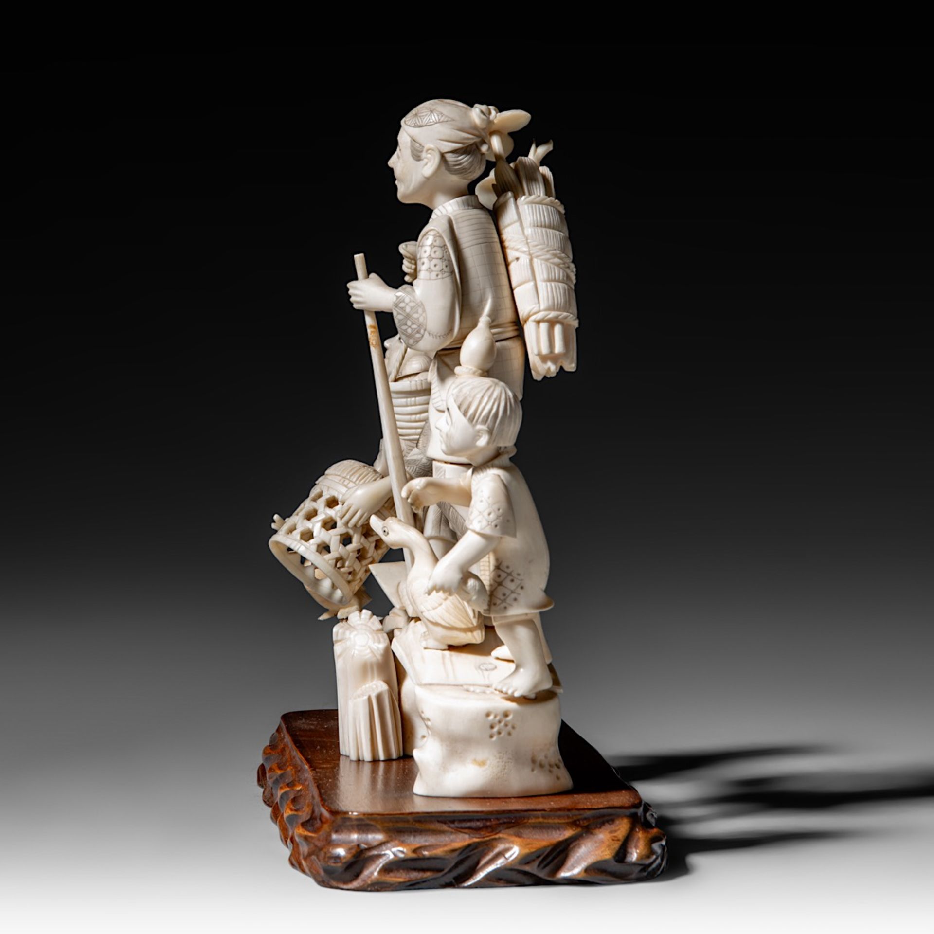 A Japanese hippo and walrus ivory okimono of a family fishing, Showa period (1926-1989), H 20 cm - W - Image 3 of 11
