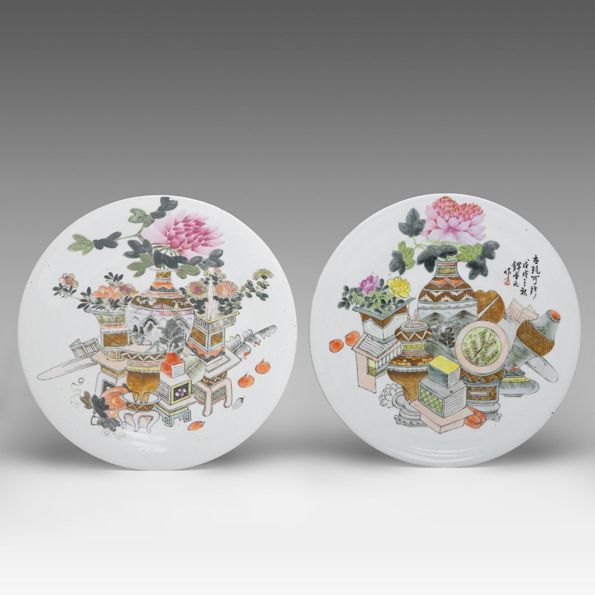Two Chinese Qianjiangcai 'One Hundred Treasures' plates, both marked, one with a signed text, 19thC,
