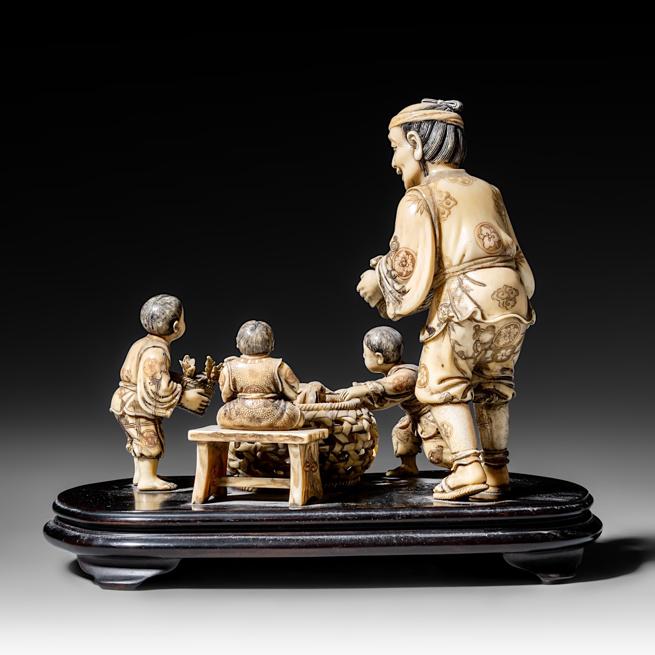 A walrus/sperm whale ivory okimono group of a family with bunnies, fixed on a black lacquered wooden - Image 5 of 10